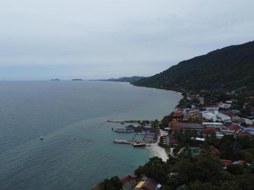 an aerial view of a town next to a body of water at Lighthouse Bungalows in Haad Rin