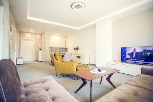 TV a/nebo společenská místnost v ubytování Apartmani SL Luxury