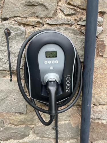 a device is hooked up to a stone wall at Little Underhill in Oswestry