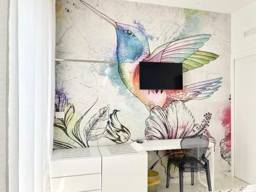 a drawing of a peacock on a wall at IL VIAGGIATORE RELAIS SUL MARE in Gaeta