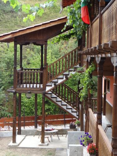 a wooden staircase on the side of a building at Недкова къща in Koprivshtitsa