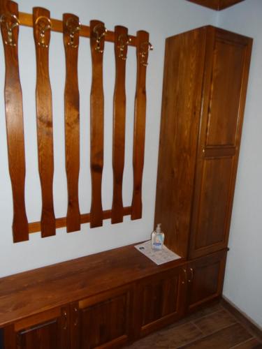 a room with a wooden wall and a wooden cabinet at Недкова къща in Koprivshtitsa