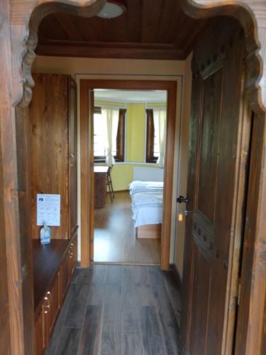 a hallway leading to a room with a bed in a room at Недкова къща in Koprivshtitsa