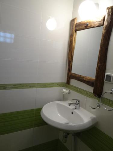 a bathroom with a sink and a mirror at Недкова къща in Koprivshtitsa
