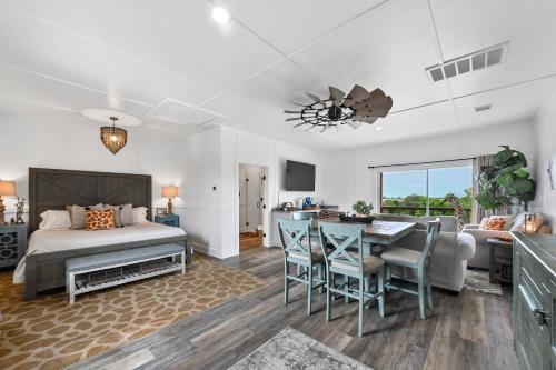 a bedroom with a bed and a dining room with a table at Blue Hills Ranch in McGregor