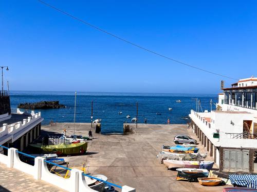 a group of boats parked next to the ocean at La Cala de Alcalá Luxury in Alcalá