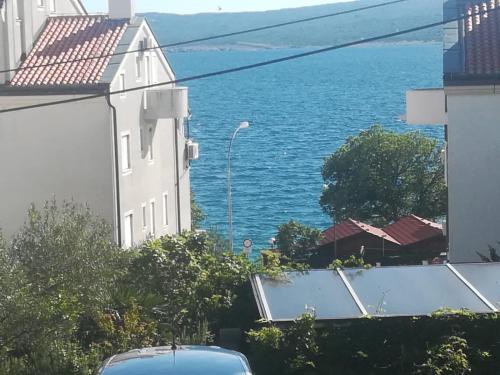 a view of the ocean from a building at apartmani selce in Selce