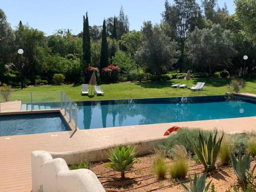 Πισίνα στο ή κοντά στο Vilamoura Concept Villa With Pool by Homing