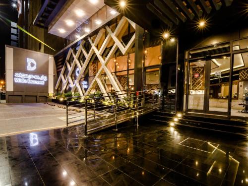 a lobby of a building at night with lights at White Diamond Hotel Sari in Jeddah