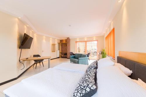 Postel nebo postele na pokoji v ubytování Pension Sonne Appartements