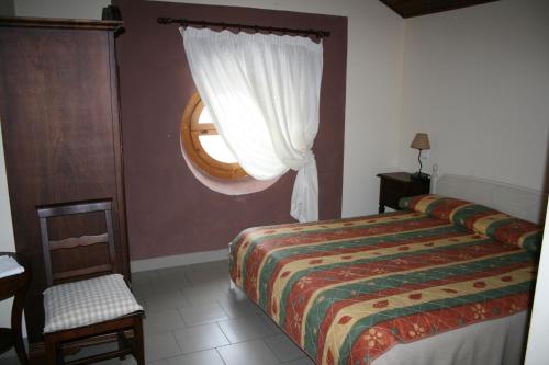 Ένα ή περισσότερα κρεβάτια σε δωμάτιο στο Locanda del Sorriso