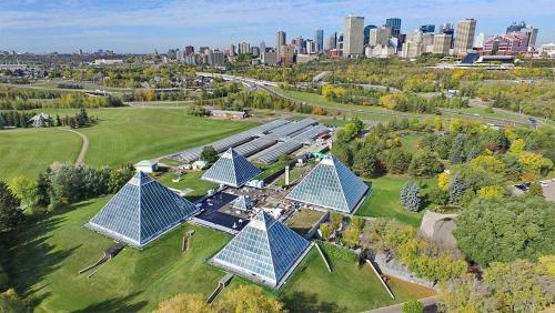 an overhead view of a building with blue roofs at Stylish Chic Home - King Bed - Free Parking & Netflix - Fast Wi-Fi - Long Stays Welcome in Edmonton