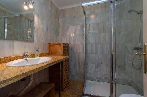 a bathroom with a sink and a shower at Oasis Dakota Duplex in Adeje