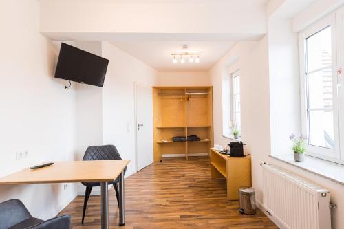 TV a/nebo společenská místnost v ubytování Pension Sonne Appartements