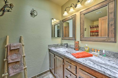 a bathroom with a sink and a mirror at Sunny Sedona Retreat with Scenic Red Rock Views in Sedona