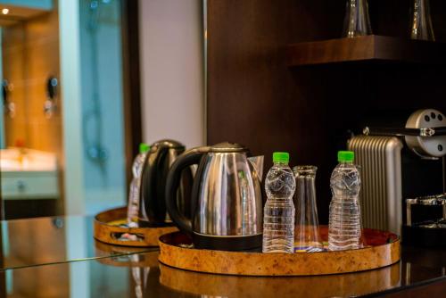 a group of bottles of water on a counter at Hôtel Tamuda Beach in M'diq