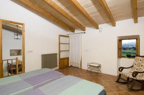 Ένα ή περισσότερα κρεβάτια σε δωμάτιο στο Agroturismo Sa Vall