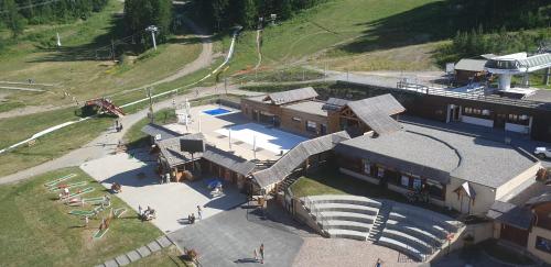 an overhead view of a building with a train station at appartement pendine 1 plein sud 53m2 in Puy-Saint-Vincent