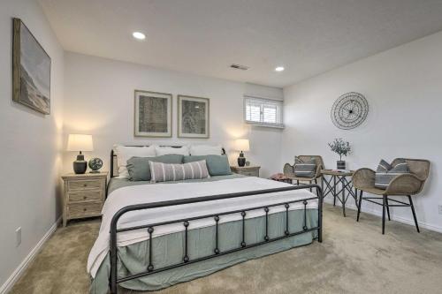 a bedroom with a large bed and a desk at Sunny St George Condo with Mtn-View Balcony! in St. George