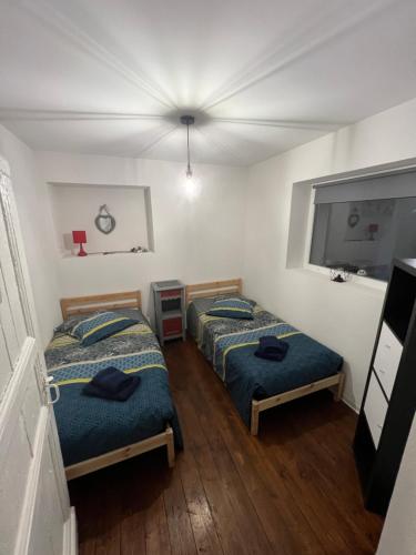 Postel nebo postele na pokoji v ubytování Chez Ben et Maé