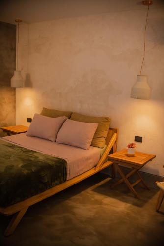 a bedroom with a bed and a table at MANGLITO MANILA in La Paz