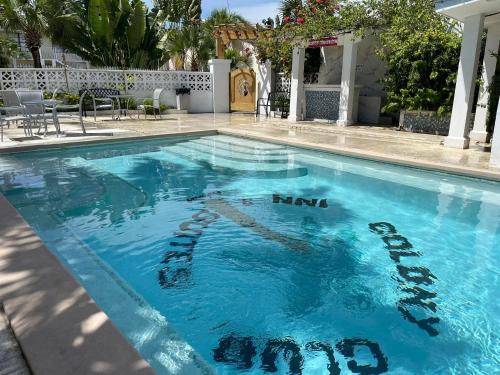 a swimming pool with the words happy new year written on it at Colony Club Inn & Suites in Nassau