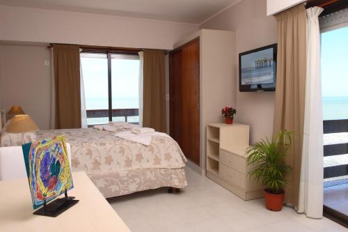 Ένα ή περισσότερα κρεβάτια σε δωμάτιο στο Apart Hotel Torre Del Sol