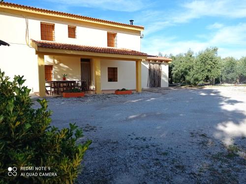 a house with a large driveway in front of it at Vivienda Rural Belén in Pozo Alcón