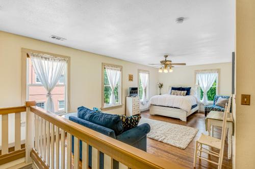 a living room with a bedroom and a bed at Taylor Cottage in Savannah