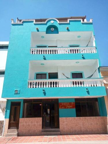 a blue building with a building at Hotel Las Vegas by CMS hotels in Santa Marta