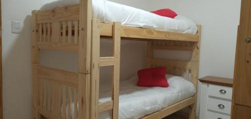 a couple of bunk beds in a room at Shabat in Ushuaia