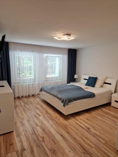 Postel nebo postele na pokoji v ubytování Apartamenty przy Świerku