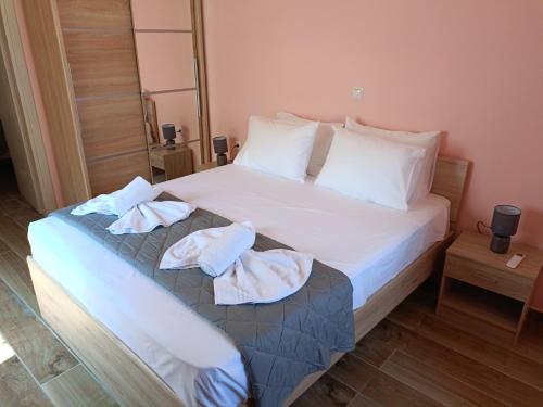 a hotel room with a bed with towels on it at Lindos Villa Euphoria in Líndos