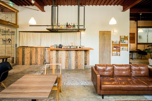 a living room with a couch and a table at fan! ABURATSU in Nichinan