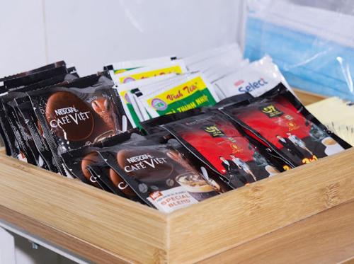 a wooden box filled with different types of chocolate at Nina homestay P1,P4 in Ap My Quo