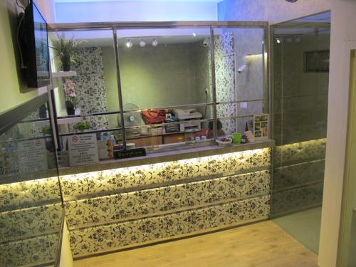 a room with a shower with a glass wall at 7 Star Hotel in Kota Damansara