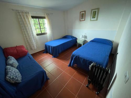 Llit o llits en una habitació de Casa Camino Los Chorros