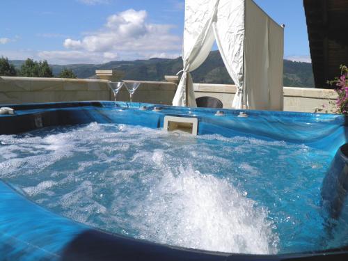 a jacuzzi tub with water in it at Palacio de Trasvilla in Escobedo