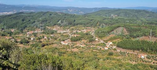 an aerial view of a small town in the mountains at Casa Pregueira in Lisboinha