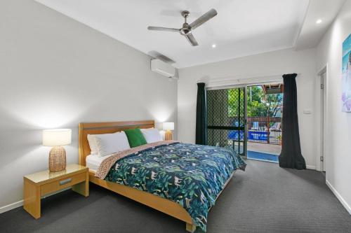 a bedroom with a bed and a window at Ivy Street 7 Dicky Beach in Caloundra
