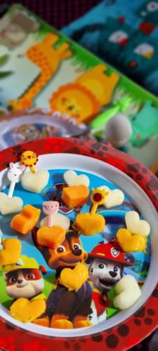 a plate of toy characters on a table at Pousada Recanto da Família in Natal