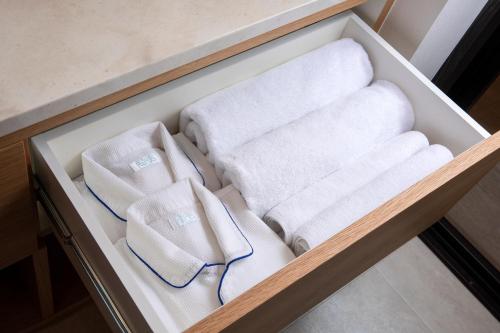 a drawer filled with towels in a bathroom at yoin hotel kyoto gion in Kyoto
