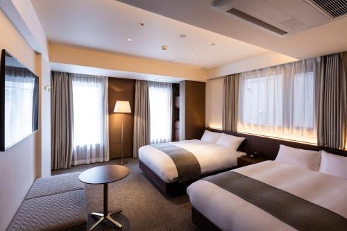 Postel nebo postele na pokoji v ubytování yoin hotel kyoto gion
