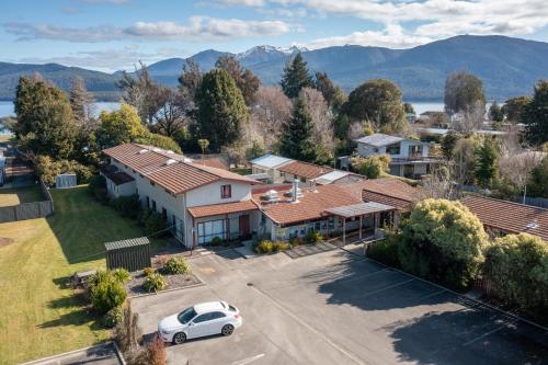 an aerial view of a house with a car parked in a driveway at Te Anau Central Backpackers in Te Anau