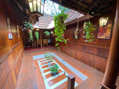 an overhead view of a porch with potted plants at Mayoorapanjaram in Neyyāttinkara