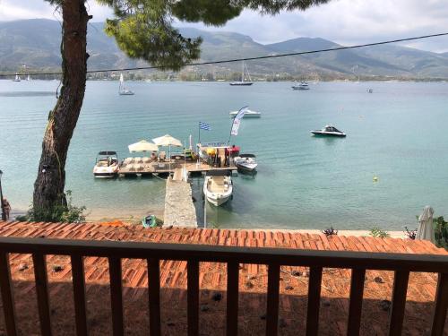 a view of a harbor with boats in the water at Sea-side 3 BEDROOM- BEACH HOUSE in Poros