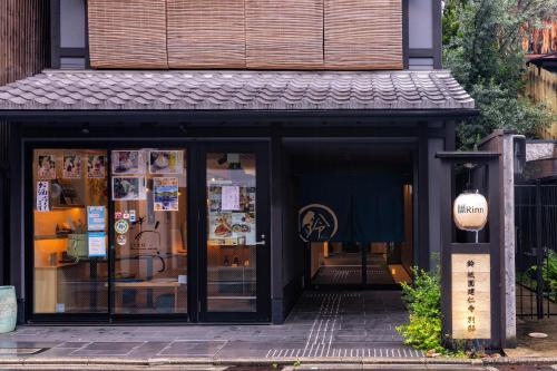 a store front with a sign in front of it at Rinn Gion Kenninji Villa in Kyoto