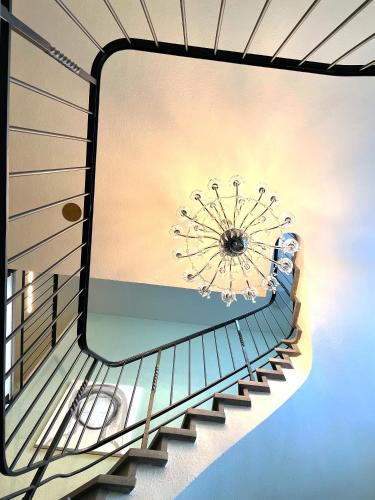 a mirror on the side of a building with a spiral staircase at Villa Maria in Luzern
