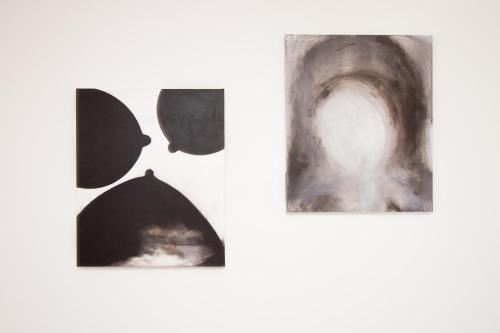 a group of black and white photographs on a white wall at Villa Maria in Luzern