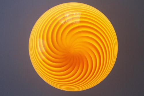 a yellow frisbee hanging in the air at Villa Maria in Luzern